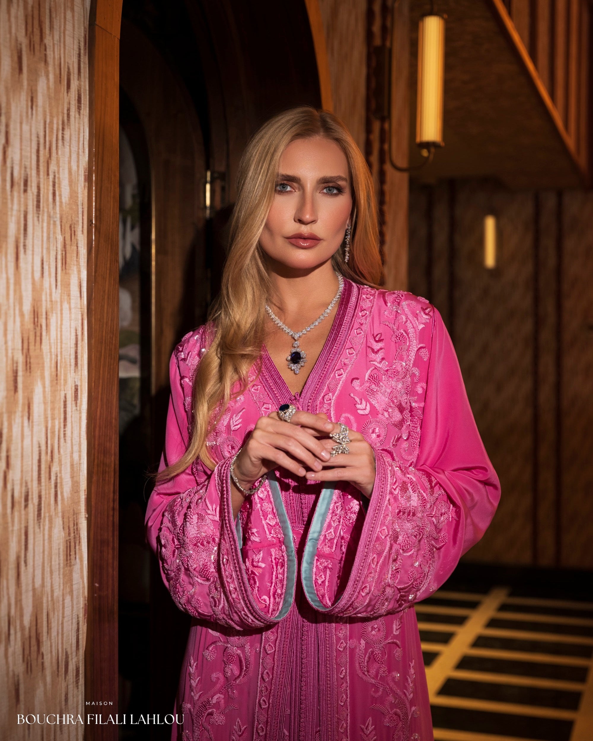Fuchsia Moroccan caftan detail with pale blue sleeve lining and ornate embroidery