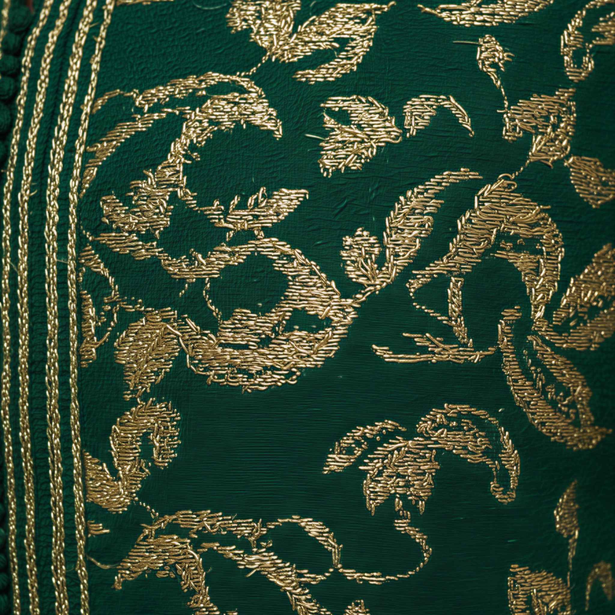Ivory Dawn kaftan embroidered fabric detail in deep green with gold thread