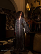Scarlet Ash full-length black Moroccan kaftan with red embroidered details