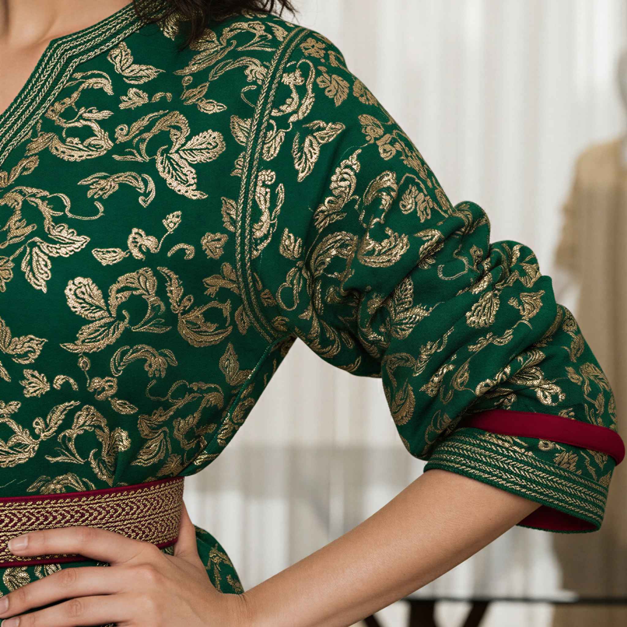 Ivory Dawn kaftan puffed sleeve detail with gold embroidery on green fabric